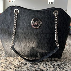 Michael Kors leather medium sized bag with silver accents and chains